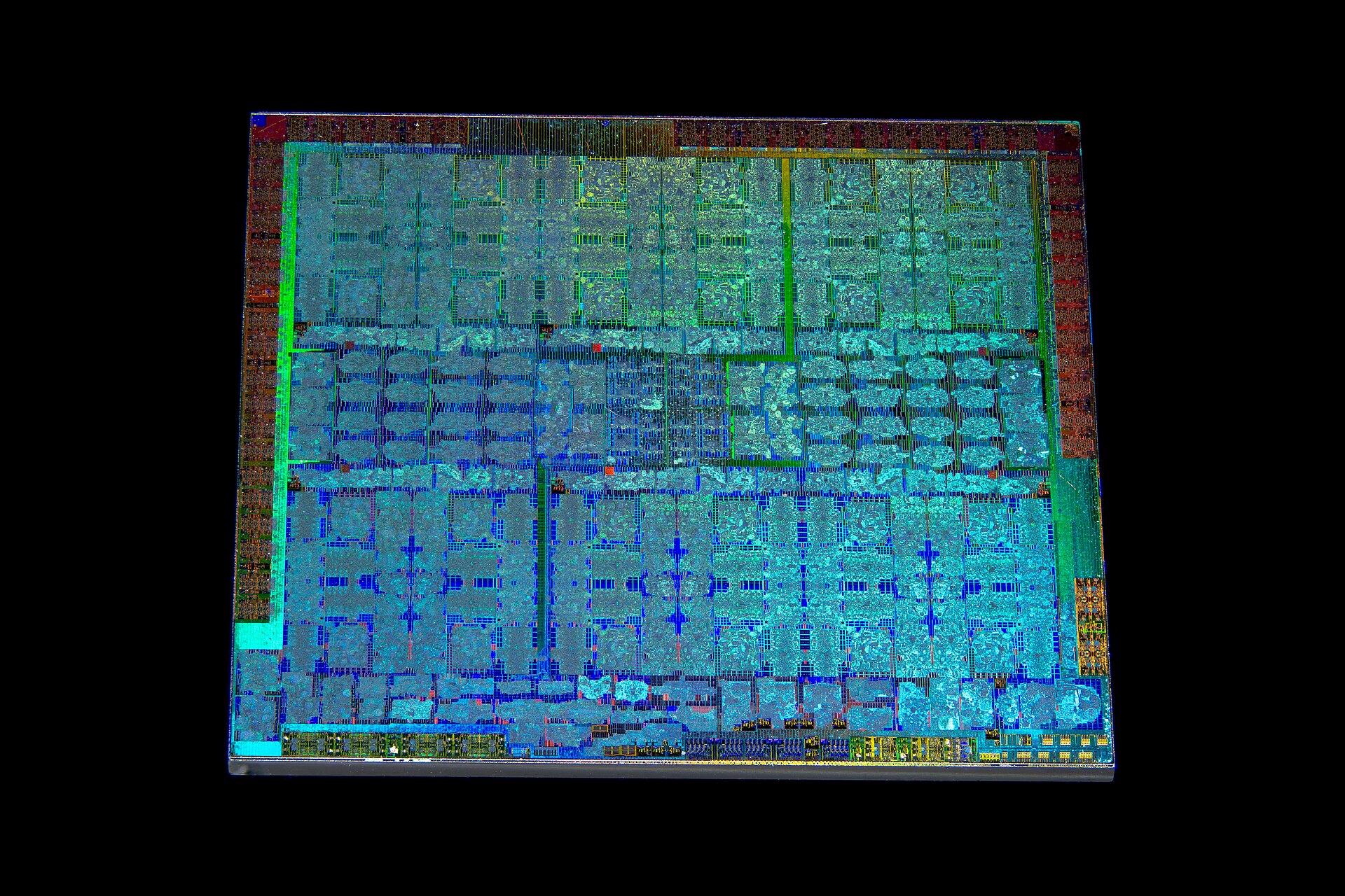 Macro photograph of an NVIDIA Turing TU104 GPU die — billions of transistors etched in silicon, lit from the edge
